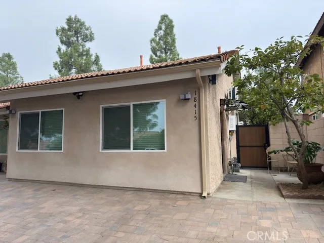 a view of front door and potted plants