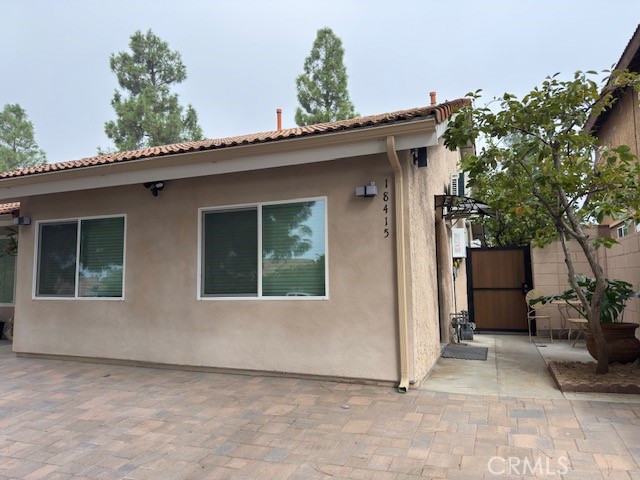 a view of front door and potted plants
