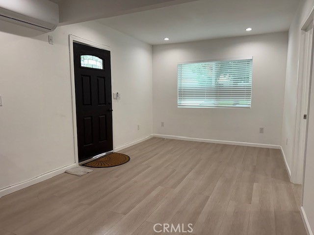18415 Tuba Street Northridge, CA 91325 - Photo 15 of 21 an empty room with wooden floor and windows