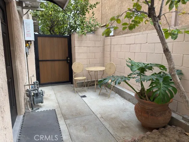 a view of a chairs and table in a patio