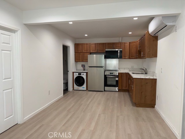 18415 Tuba Street Northridge, CA 91325 - Photo 7 of 21 a kitchen with stainless steel appliances granite countertop a refrigerator sink and cabinets