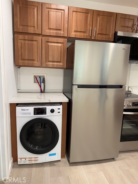 18415 Tuba Street Northridge, CA 91325 - Photo 9 of 21 a white refrigerator freezer and a stove sitting inside of a kitchen