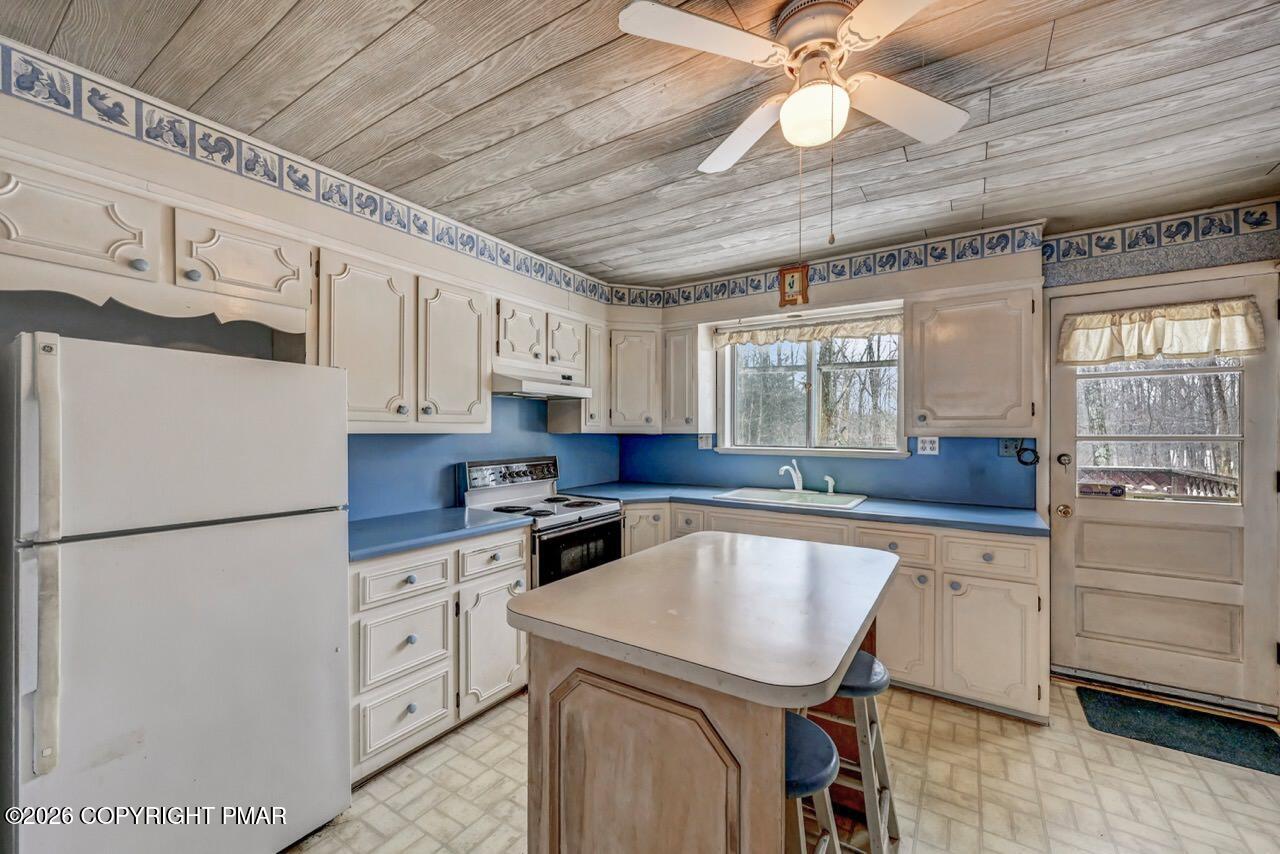 1912 Johns Road Effort, PA 18330 - Photo 10 of 44 a kitchen with cabinets appliances a sink and a stove