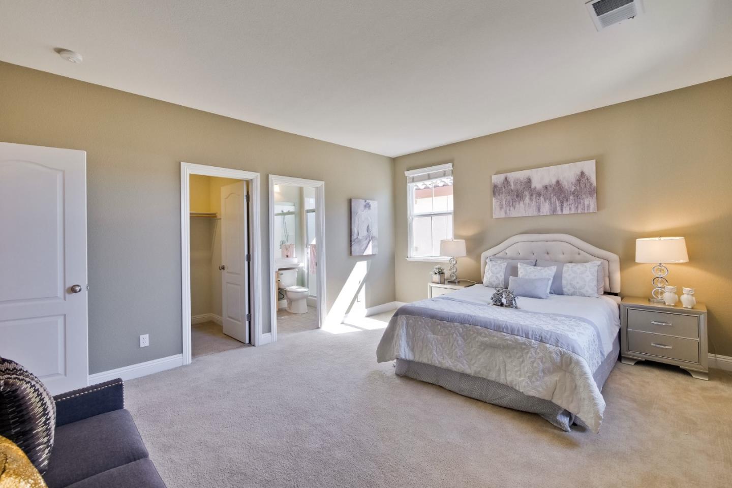 801 Pipers Brook Court San Ramon, CA 94582 - Photo 54 of 78 a spacious bedroom with a bed and a couch