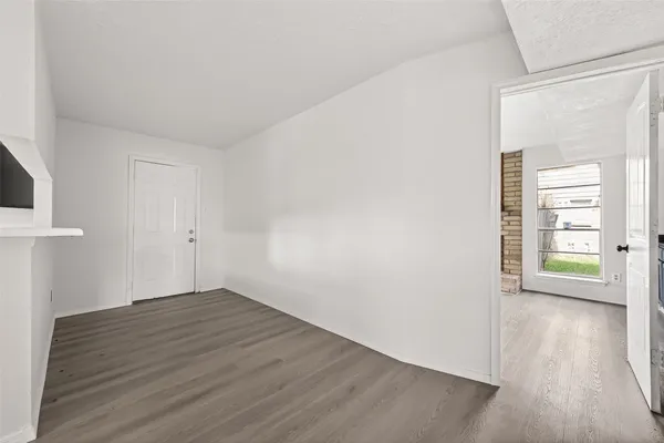 a view of a kitchen with wooden floor