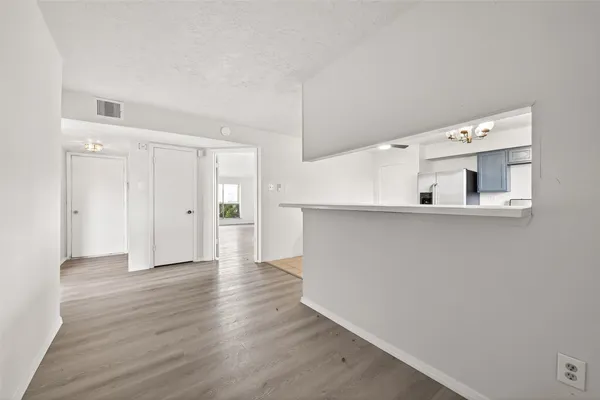 a kitchen with cabinets and stainless steel appliances