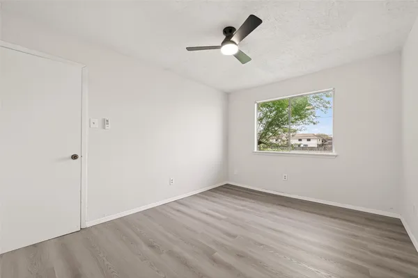 a bathroom with a sink vanity tub and shower