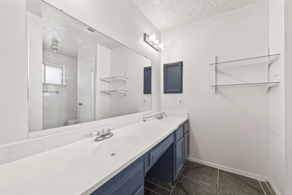 a bathroom with a bathtub and window