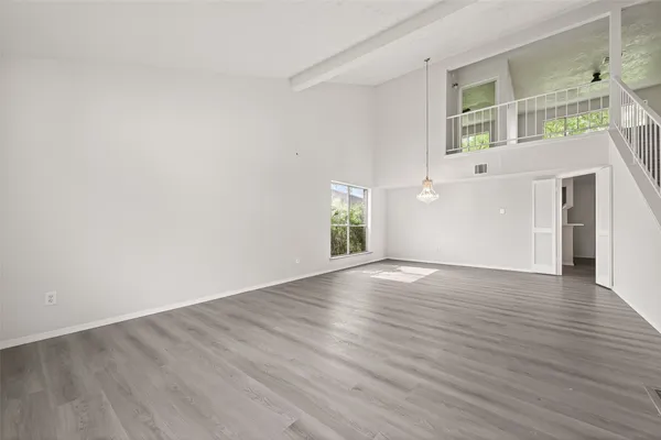 a view of an entryway with wooden floor