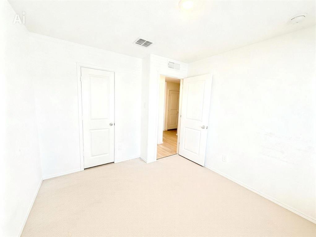 7855 Rutherford Lane McKinney, TX 75071 - Photo 24 of 27 Carpeted flooring, white interior walls, interior paneled doors, recessed ceiling light, and ceiling air vent