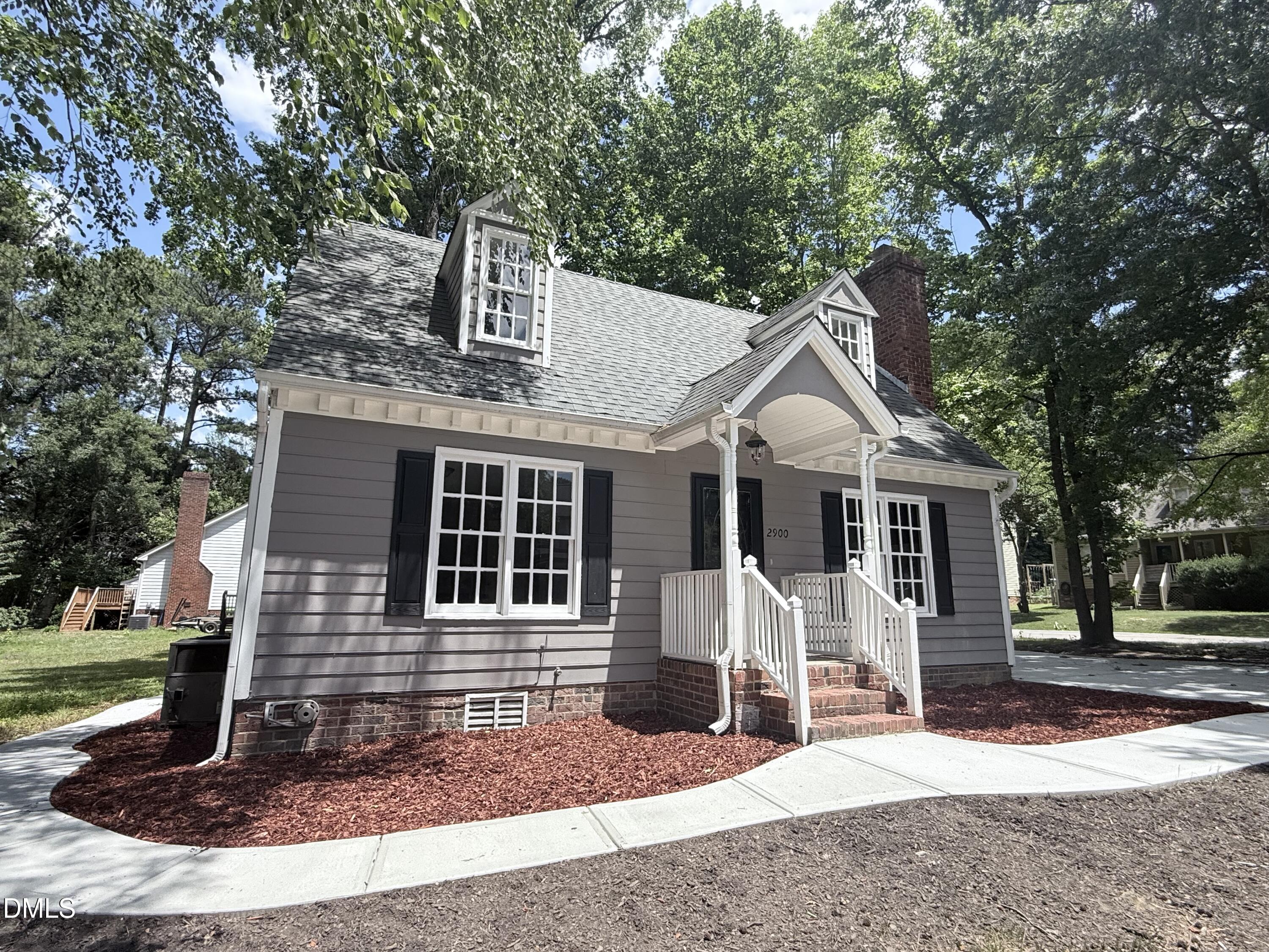 2900 Broadlands Drive Raleigh, NC 27604 - Photo 3 of 60 a front view of a house with a yard