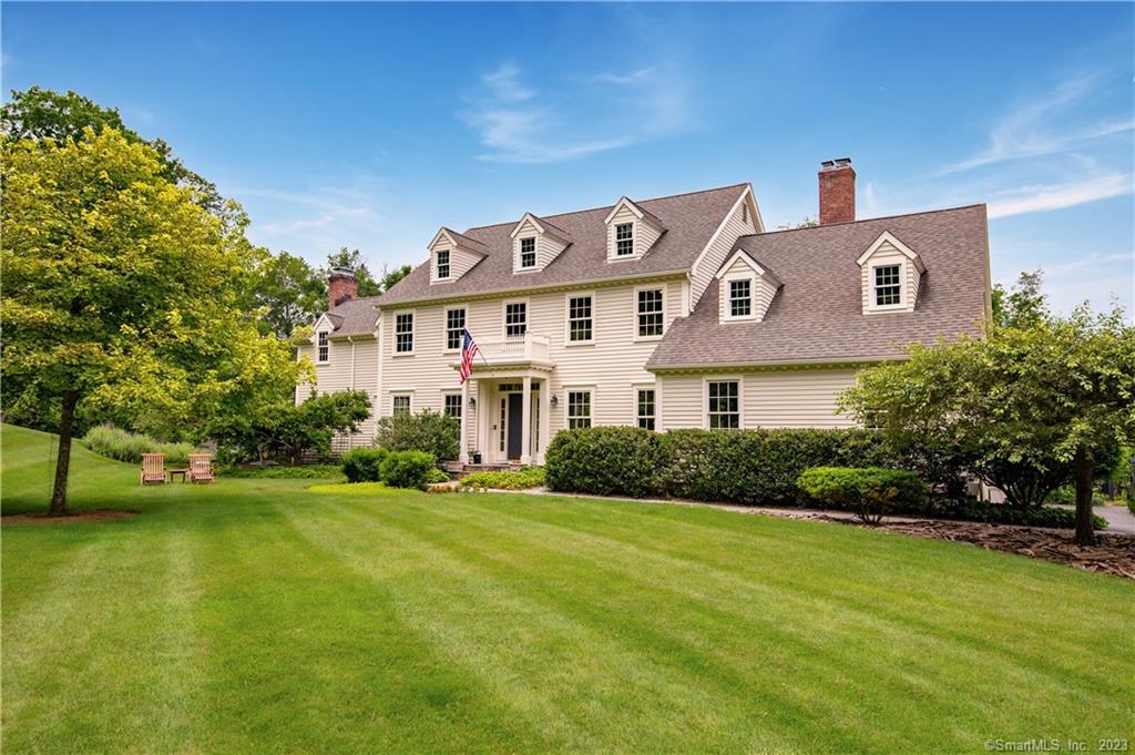 15 Sherwood Road Ridgefield, CT 06877 - Photo 1 of 1 a front view of a house with a yard