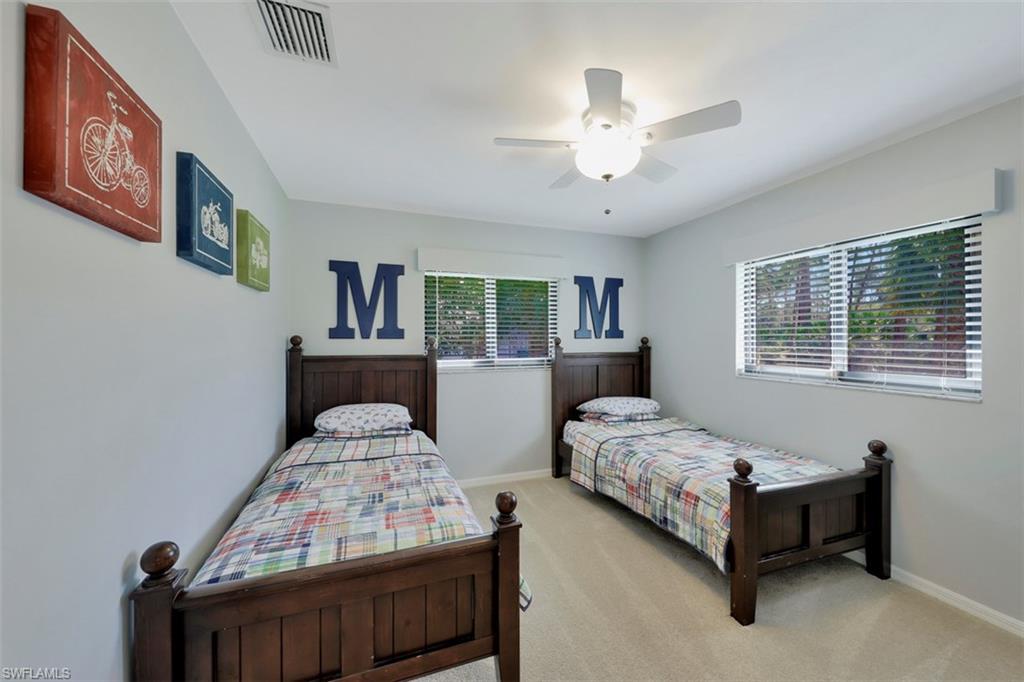 5260 Mahogany Ridge Drive Naples, FL 34119 - Photo 12 of 15 a bedroom with bed and window