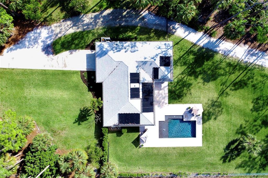 5260 Mahogany Ridge Drive Naples, FL 34119 - Photo 13 of 15 an aerial view of residential house with outdoor space and trees all around
