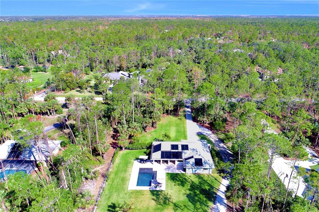 5260 Mahogany Ridge Drive Naples, FL 34119 - Photo 14 of 15 a view of outdoor space and yard