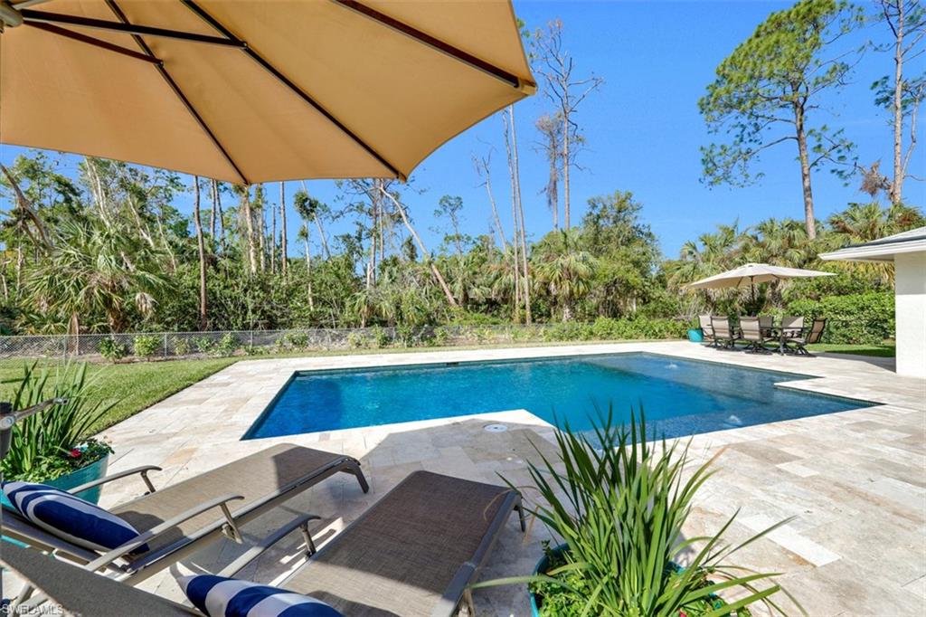 5260 Mahogany Ridge Drive Naples, FL 34119 - Photo 3 of 15 a view of swimming pool with lounge chair