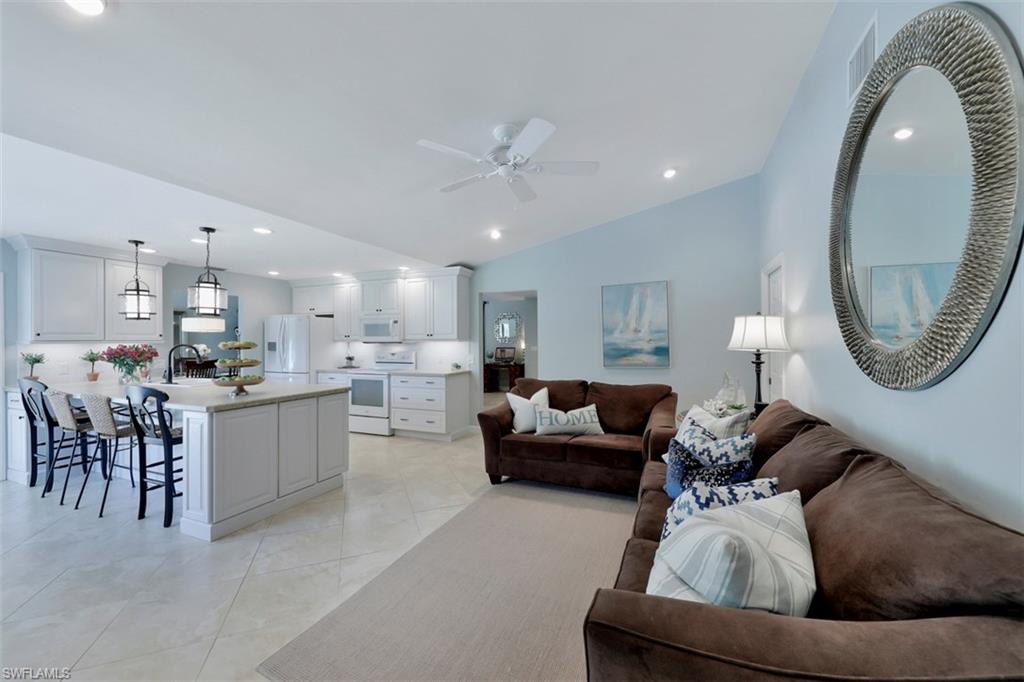 5260 Mahogany Ridge Drive Naples, FL 34119 - Photo 9 of 15 a living room with furniture and a mirror