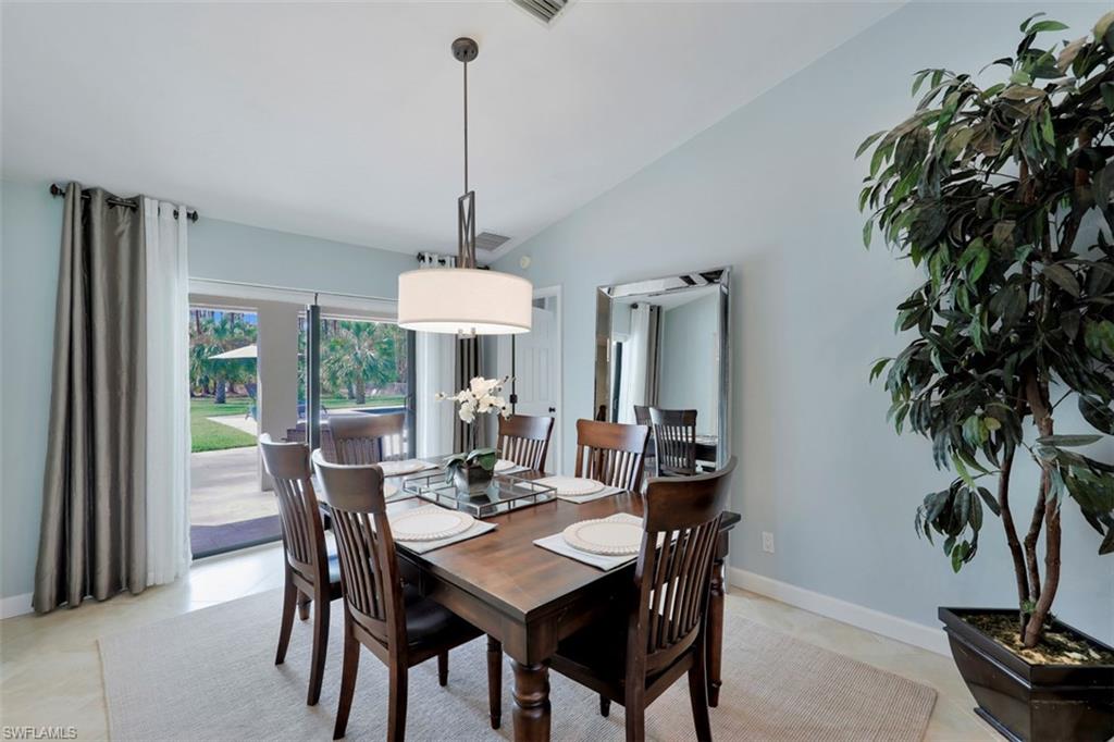 5260 Mahogany Ridge Drive Naples, FL 34119 - Photo 10 of 15 a view of a dining room with furniture window and outside view