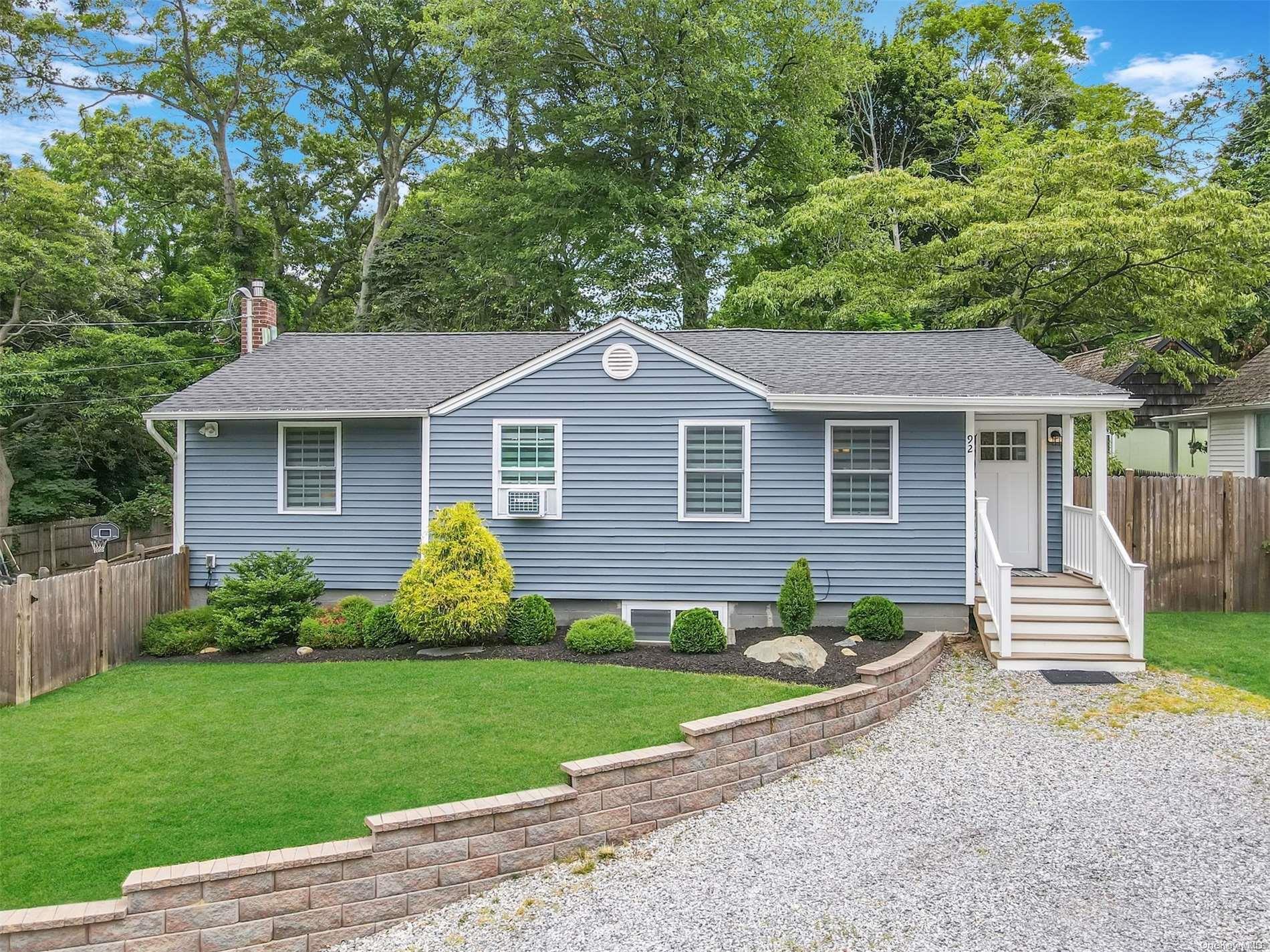 92 Cherry Road Rocky Point, NY 11778 - Photo 1 of 1 a front view of a house with a garden and yard