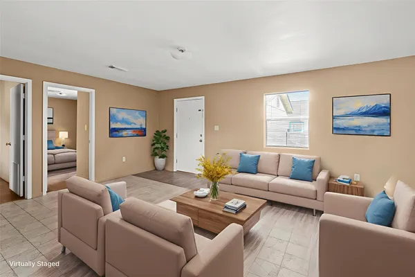 a living room with furniture and a large window