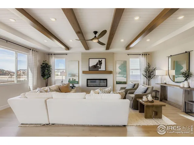 a living room with fireplace furniture and a flat screen tv