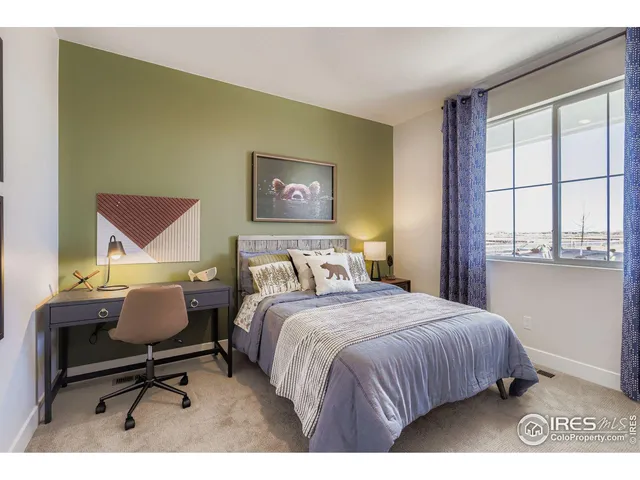 a bathroom with a granite countertop sink a toilet a mirror and shower