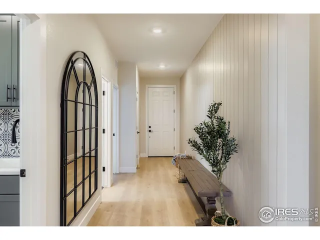 a view of entryway with a flower pot and a wooden floor