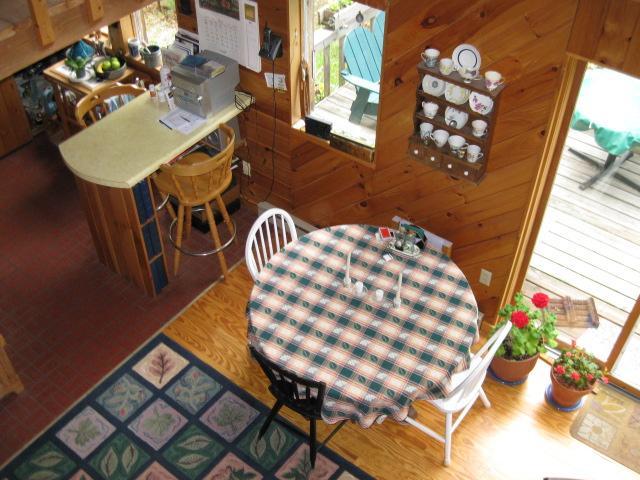 331 West Center Road Otis, MA 01253 - Photo 5 of 8 a view of a dining room with furniture and wooden floor