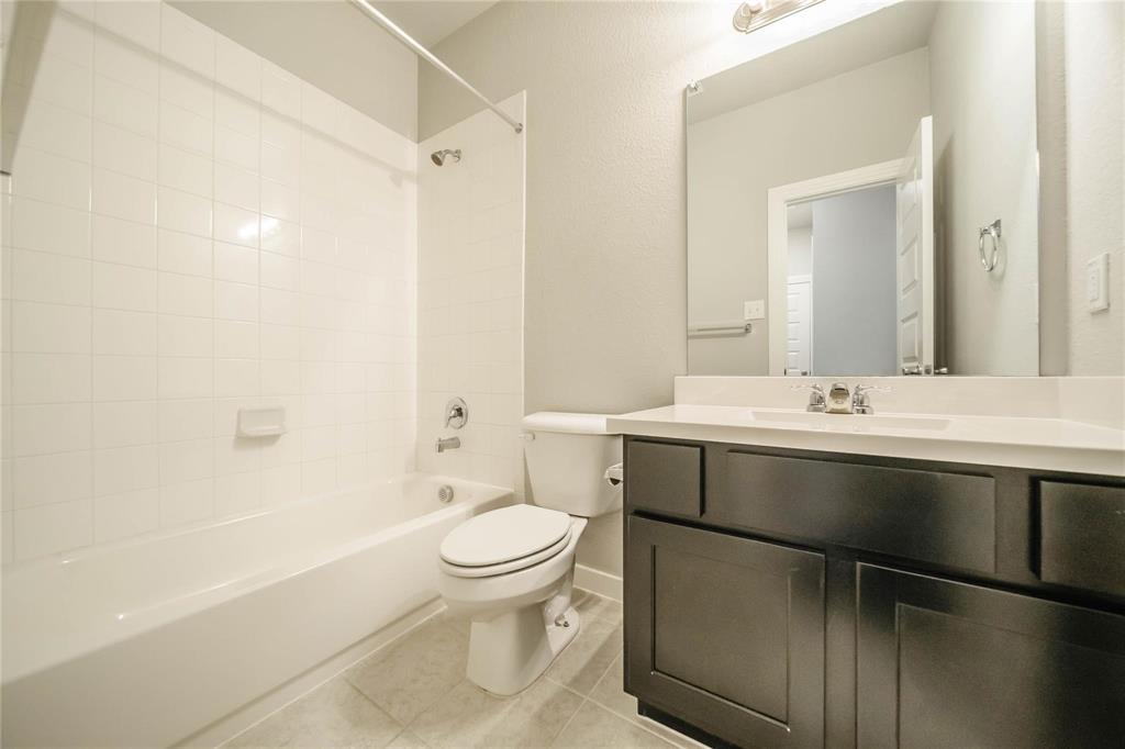 1113 Sheldon Drive Anna, TX 75409 - Photo 11 of 35 a bathroom with a sink toilet and shower