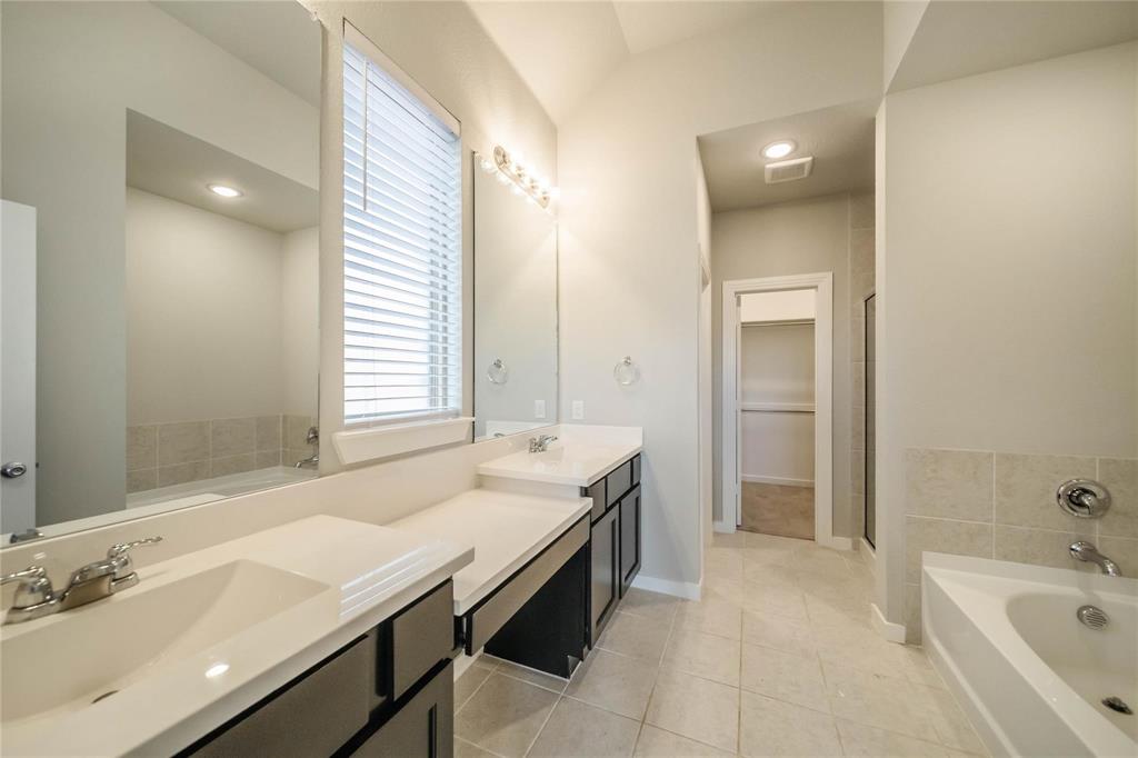 1113 Sheldon Drive Anna, TX 75409 - Photo 24 of 35 a spacious bathroom with a tub sink and mirror