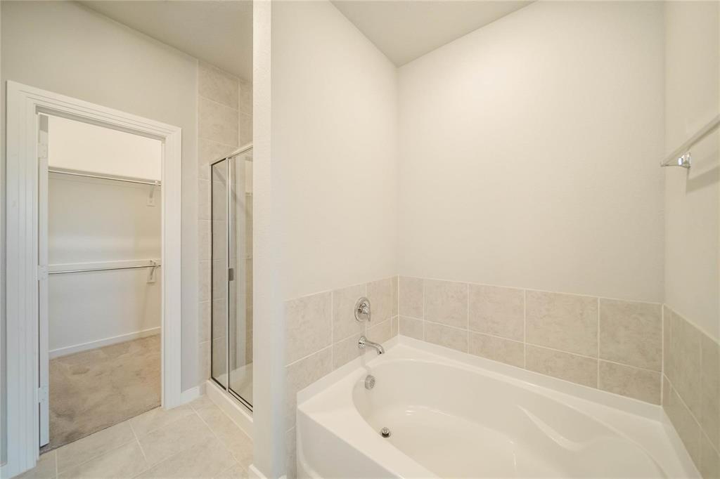 1113 Sheldon Drive Anna, TX 75409 - Photo 25 of 35 a white bath tub sitting next to a white sink