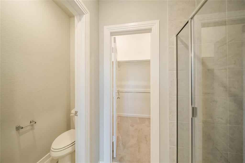 1113 Sheldon Drive Anna, TX 75409 - Photo 26 of 35 a bathroom with a shower and a toilet