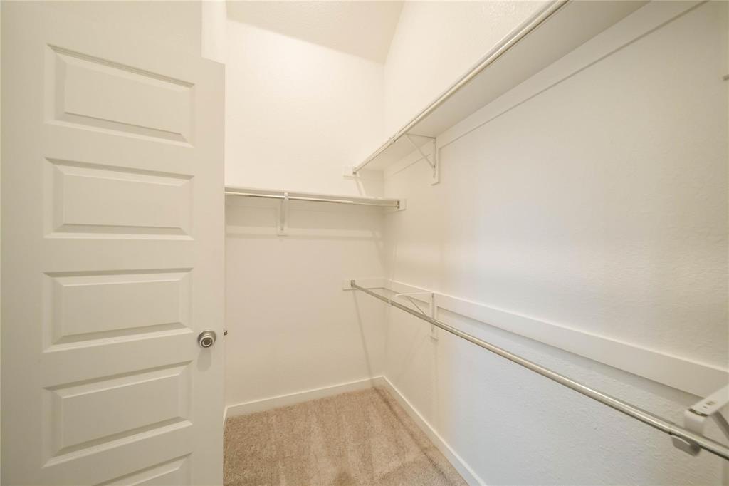 1113 Sheldon Drive Anna, TX 75409 - Photo 27 of 35 a view of walk in closet with empty racks