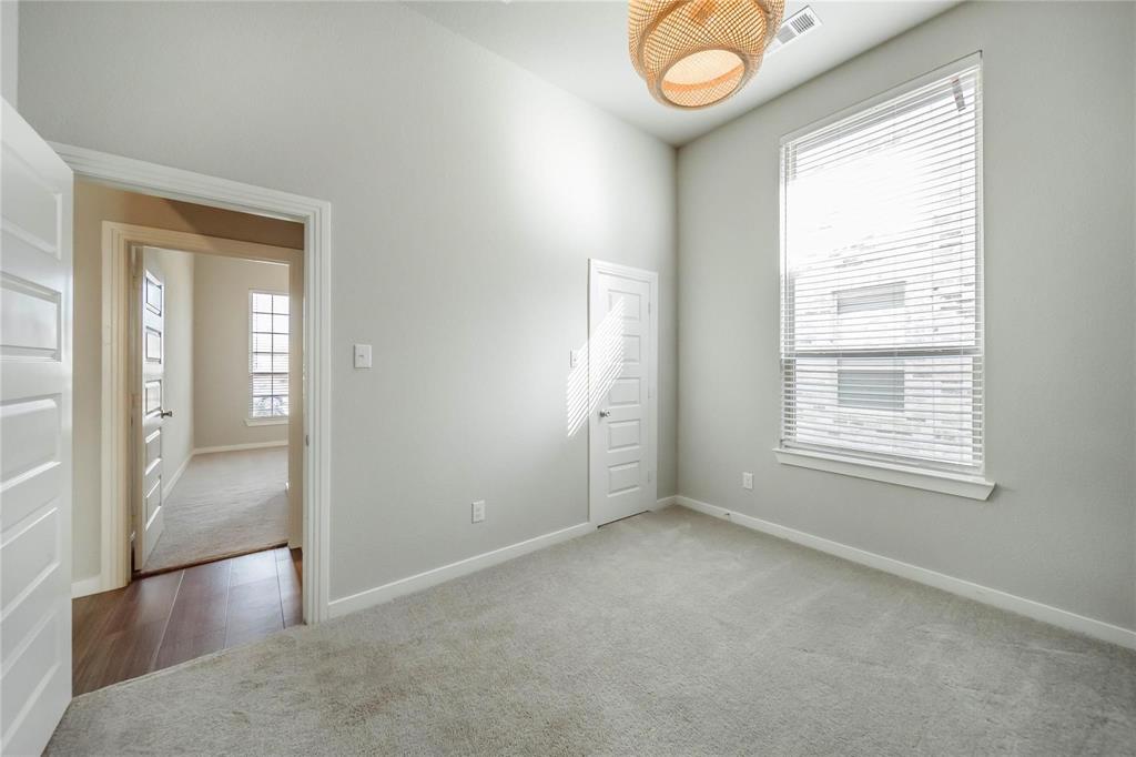 1113 Sheldon Drive Anna, TX 75409 - Photo 4 of 35 an empty room that has a window and wooden floor