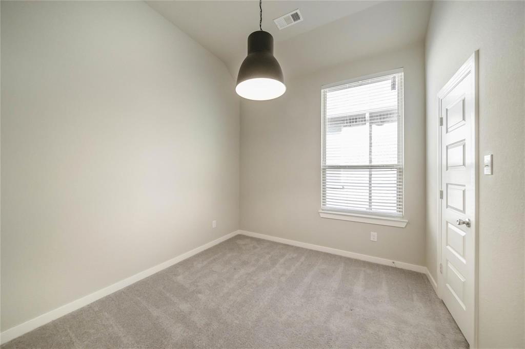 1113 Sheldon Drive Anna, TX 75409 - Photo 6 of 35 an empty room with a window and wooden floor