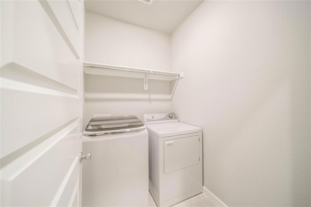 1113 Sheldon Drive Anna, TX 75409 - Photo 8 of 35 a utility room with dryer and washer
