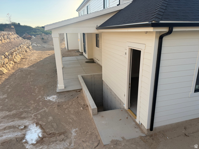 258 East Maple Rdg Drive Mapleton, UT 84664 - Photo 50 of 52 White horizontal siding exterior with dark shingle roof and contrasting black gutters