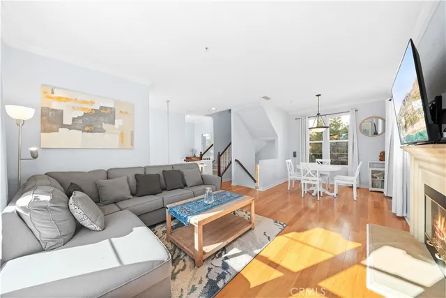a view of a dining room with furniture wooden floor and a chandelier