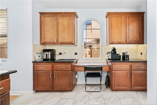 a kitchen with stainless steel appliances granite countertop a stove and a sink