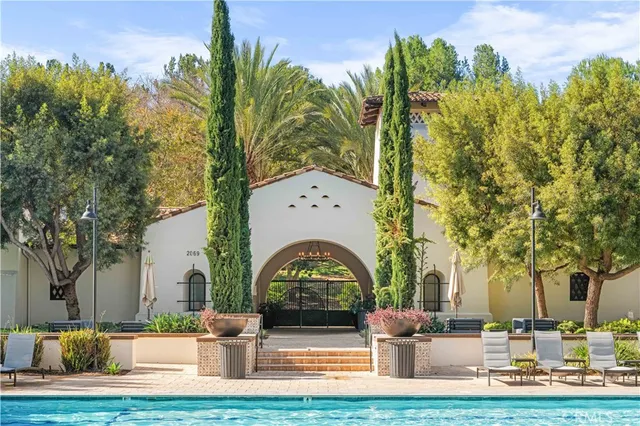 a view of a yard with large trees