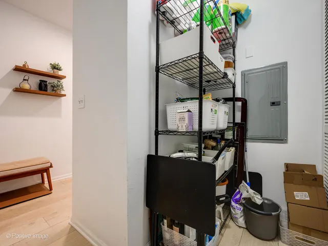 a dining room with furniture and a potted plant
