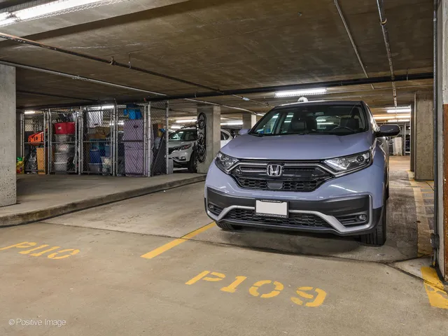 a living room with furniture and a mirror