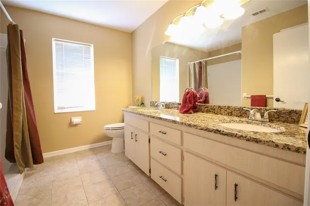 a bath room with a sink and a mirror