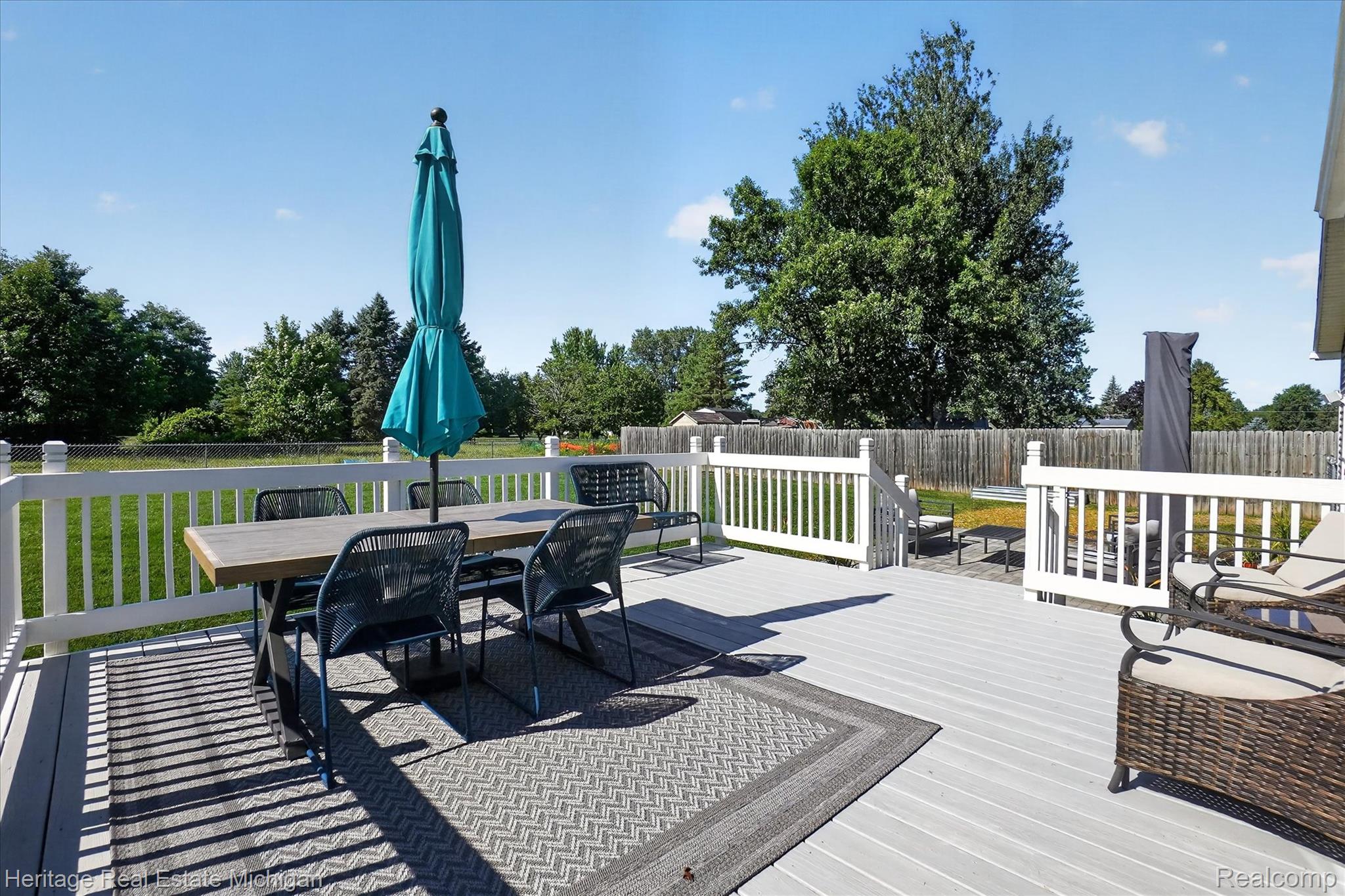 7225 Baldwin Road Swartz Creek, MI 48473 - Photo 37 of 44 Spacious gray composite deck with white railings