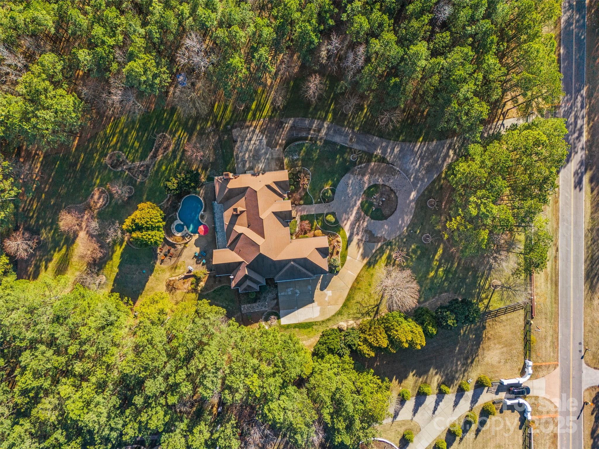 1024 State Rd S-46-181 York, SC 29745 - Photo 43 of 45 an aerial view of a house with a yard and large trees