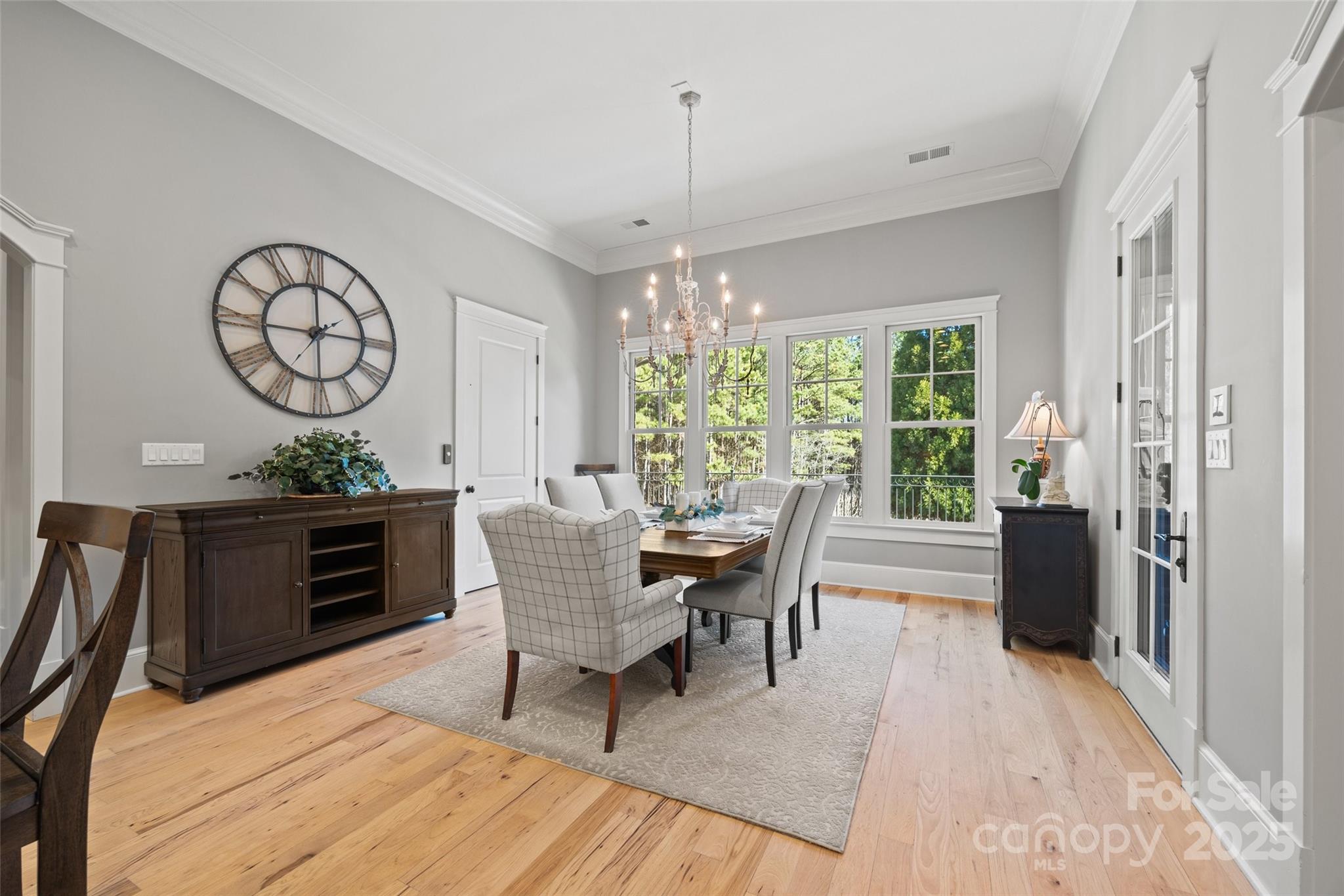 1024 State Rd S-46-181 York, SC 29745 - Photo 9 of 45 a dining room with furniture a chandelier and wooden floor