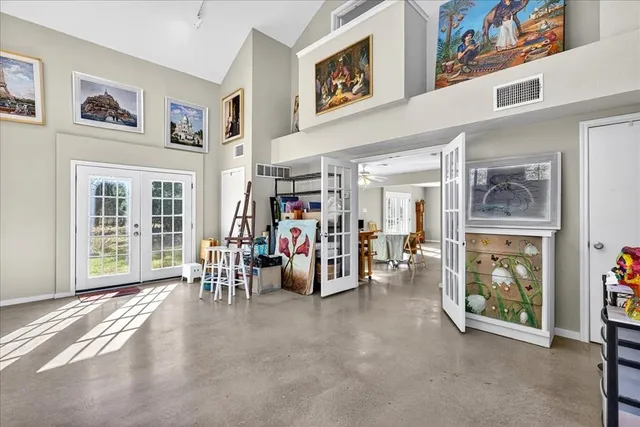 a view of a livingroom with furniture and a window