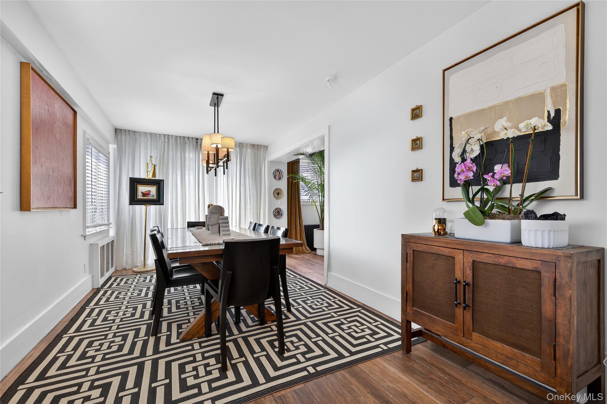 3 Beacon Hill Road Port Washington, NY 11050 - Photo 11 of 43 a view of a dining room with furniture window and wooden floor