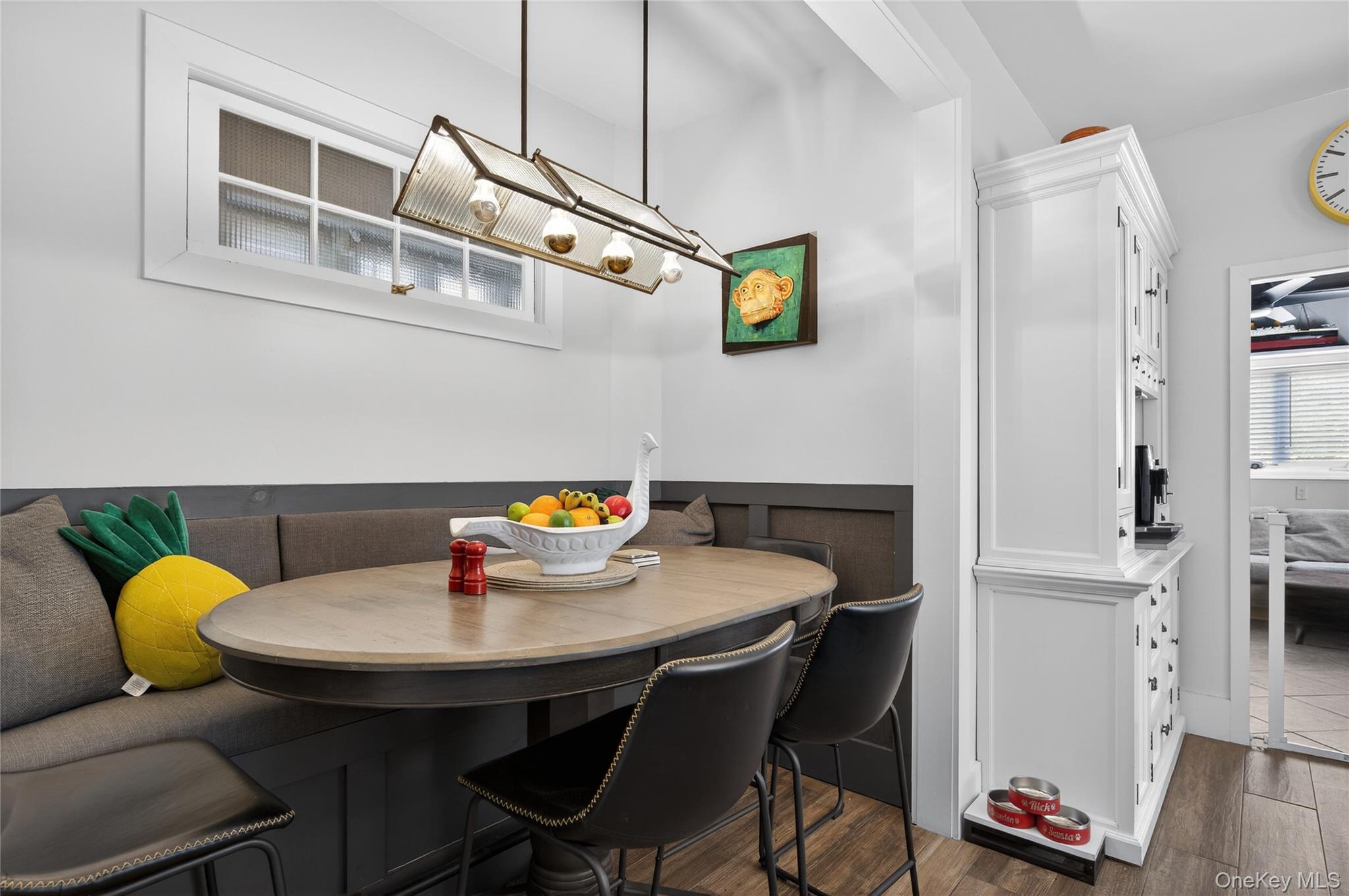 3 Beacon Hill Road Port Washington, NY 11050 - Photo 15 of 43 a view of a dining room with furniture and wooden floor
