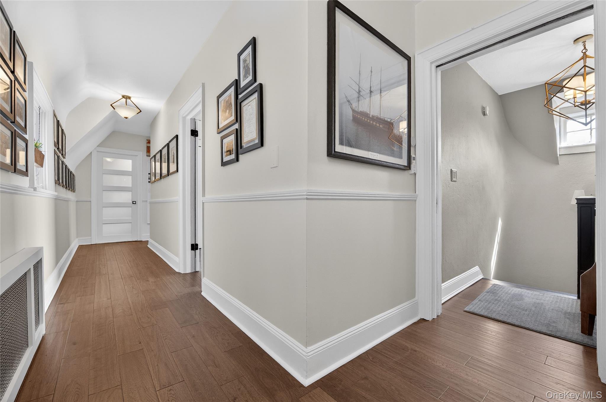 3 Beacon Hill Road Port Washington, NY 11050 - Photo 19 of 43 a view of a hallway with wooden floor and hallway